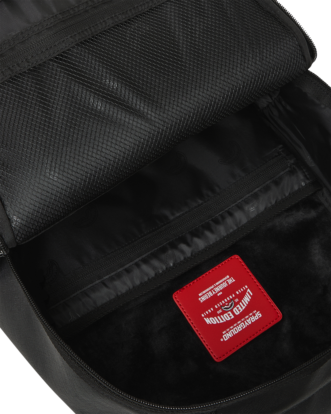 BLACKED OUT EMBOSSED GOLD TOOTH DLXSV BACKPACK